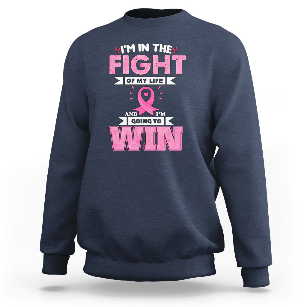 Navy crewneck sweatshirt with pink ribbon and 'FIGHT' and 'WIN' graphic print