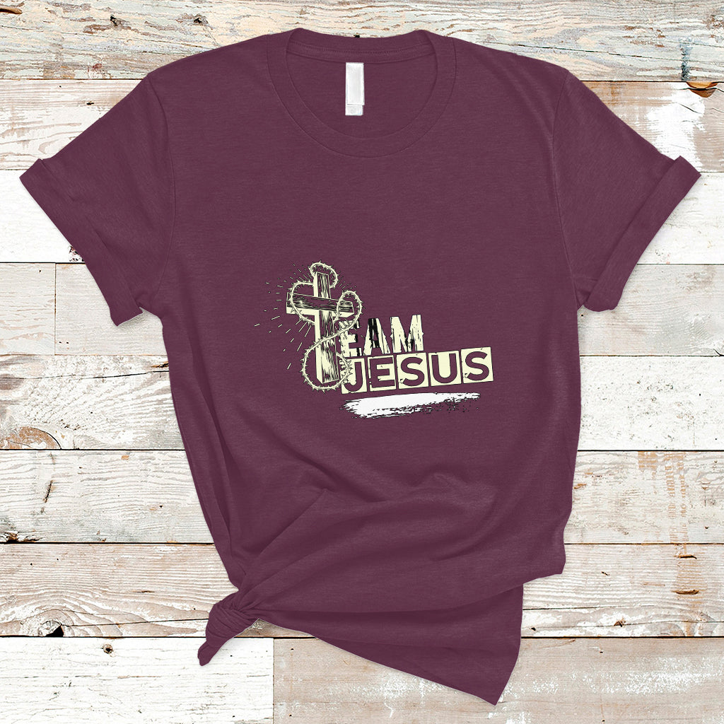 Maroon T-shirt with front “Team Jesus” graphic and cross emblem