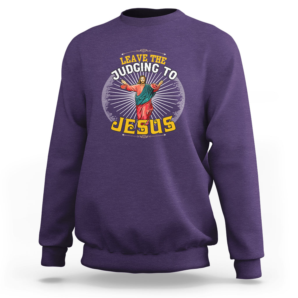 Purple sweatshirt with chest graphic reading “Leave the Judging to Jesus”
