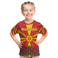Macedonia Christmas Kid T Shirt with Yellow Sun, Santa, and Festive Tree Motif - Wonder Print Shop