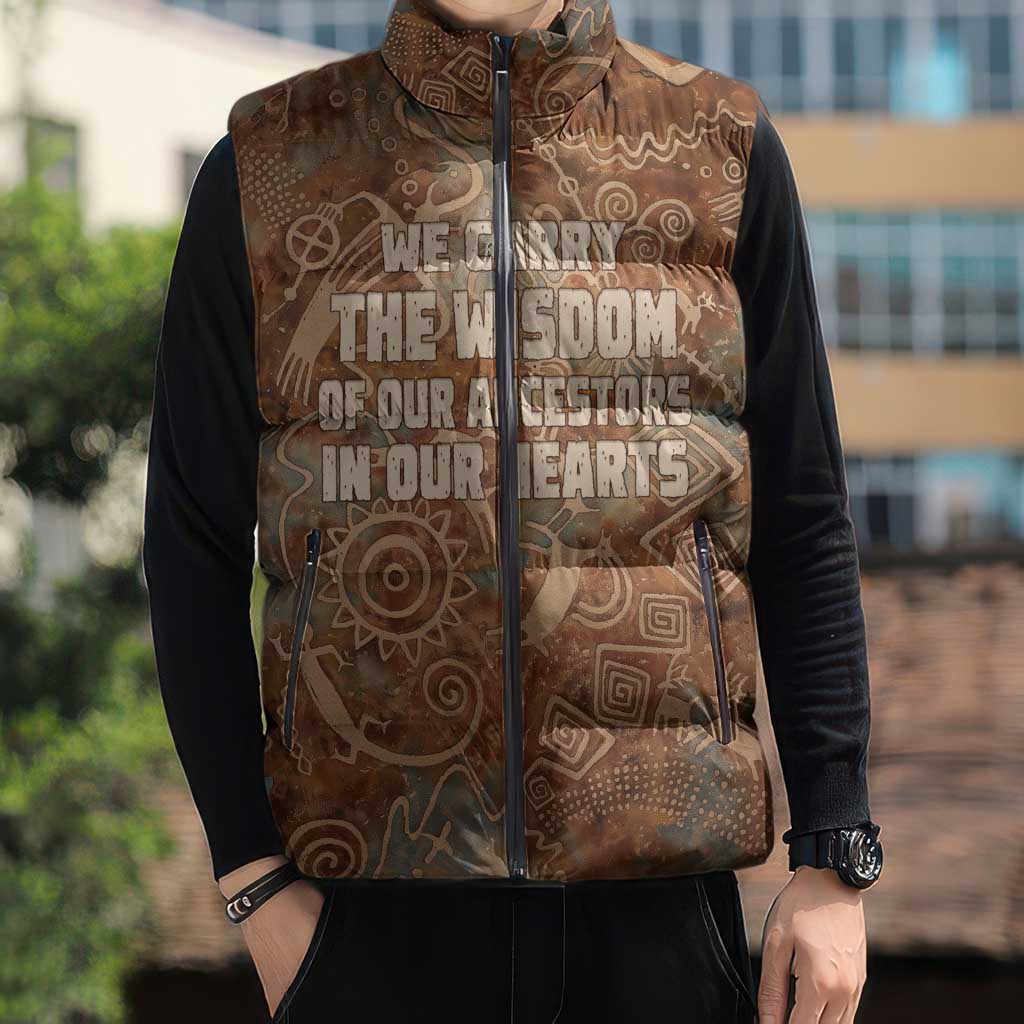 We Carry The Wisdom Sleeveless Puffer Jacket African Ancient Symbols, Earthy Tones, and Ancestral Wisdom Quote - Wonder Print Shop