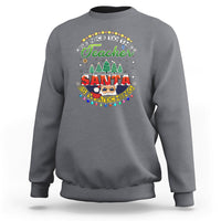 Charcoal gray teacher sweatshirt with colorful Santa-watching holiday graphic on chest.