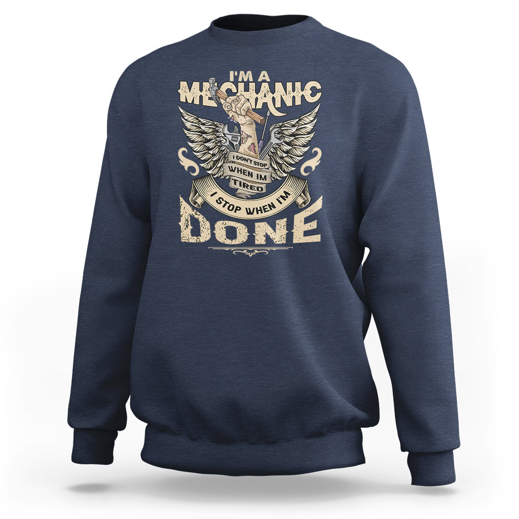 Navy crewneck mechanic sweatshirt with winged “DONE” graphic on the front.