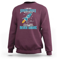 Maroon crewneck sweatshirt with colorful astronaut graphic and tech-style text print on chest