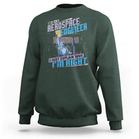 Dark forest green crewneck sweatshirt with space engineer graphic and slogan on the front, long sleeves.