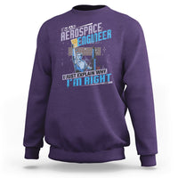 Purple crewneck sweatshirt with space engineer graphic and slogan on the front, long sleeves.