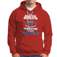 Red hoodie with aviation-themed “Inspector” graphic on the chest and front pocket.