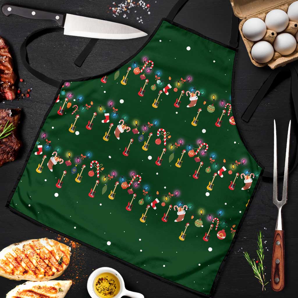 Ornaments on Green Snowy Background Apron with Electric Guitars Santa Candy Canes - Wonder Print Shop