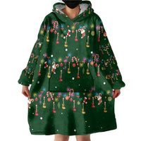 Ornaments on Green Snowy Background Wearable Blanket Hoodie with Electric Guitars Santa Candy Canes - Wonder Print Shop