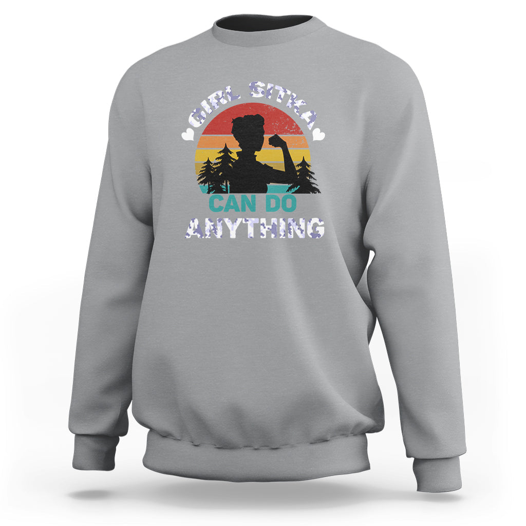 Girls sport gray crewneck sweatshirt with "CAN DO ANYTHING" outdoor graphic on front