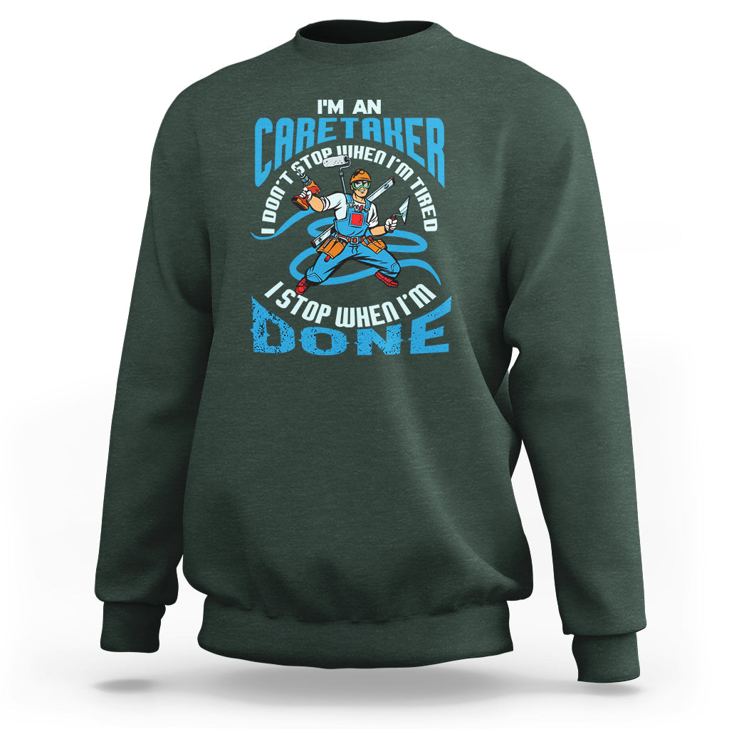 Dark forest green sweatshirt with caregiver motivational graphic on the chest