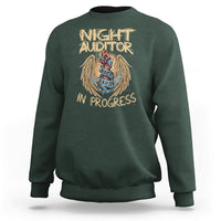Dark forest green crewneck sweatshirt with Night Auditor in progress angel emblem