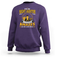 Purple crewneck sweatshirt with bold yellow graphic front text and character art