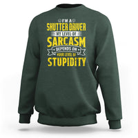 Dark forest green crewneck sweatshirt with yellow “Sarcasm” driver graphic on the chest