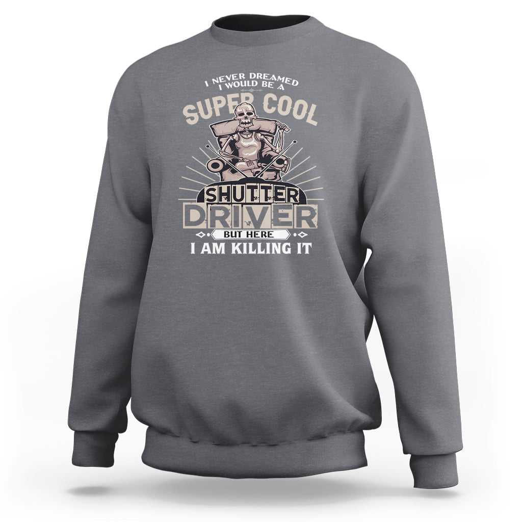 Charcoal gray crewneck sweatshirt with front “Shutter Driver” graphic print.
