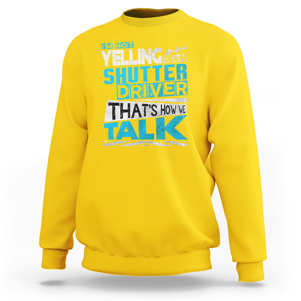 Daisy yellow crewneck sweatshirt with colorful 'Shutter Driver' 'That's how we talk' print