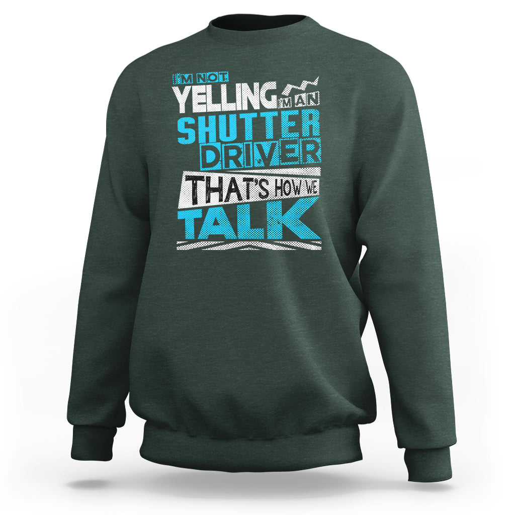 Dark forest green crewneck sweatshirt with colorful 'Shutter Driver' 'That's how we talk' print