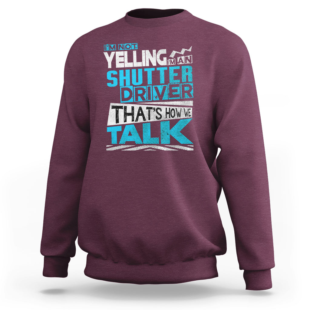 Maroon crewneck sweatshirt with colorful 'Shutter Driver' 'That's how we talk' print