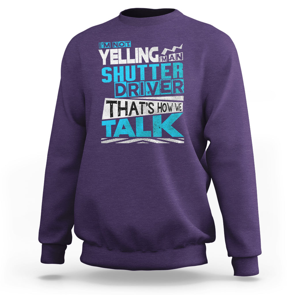 Purple crewneck sweatshirt with colorful 'Shutter Driver' 'That's how we talk' print