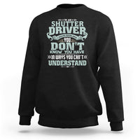 Black crewneck sweatshirt with large front “Shutter Driver” graphic print.