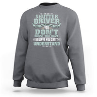 Charcoal crewneck sweatshirt with large front “Shutter Driver” graphic print.