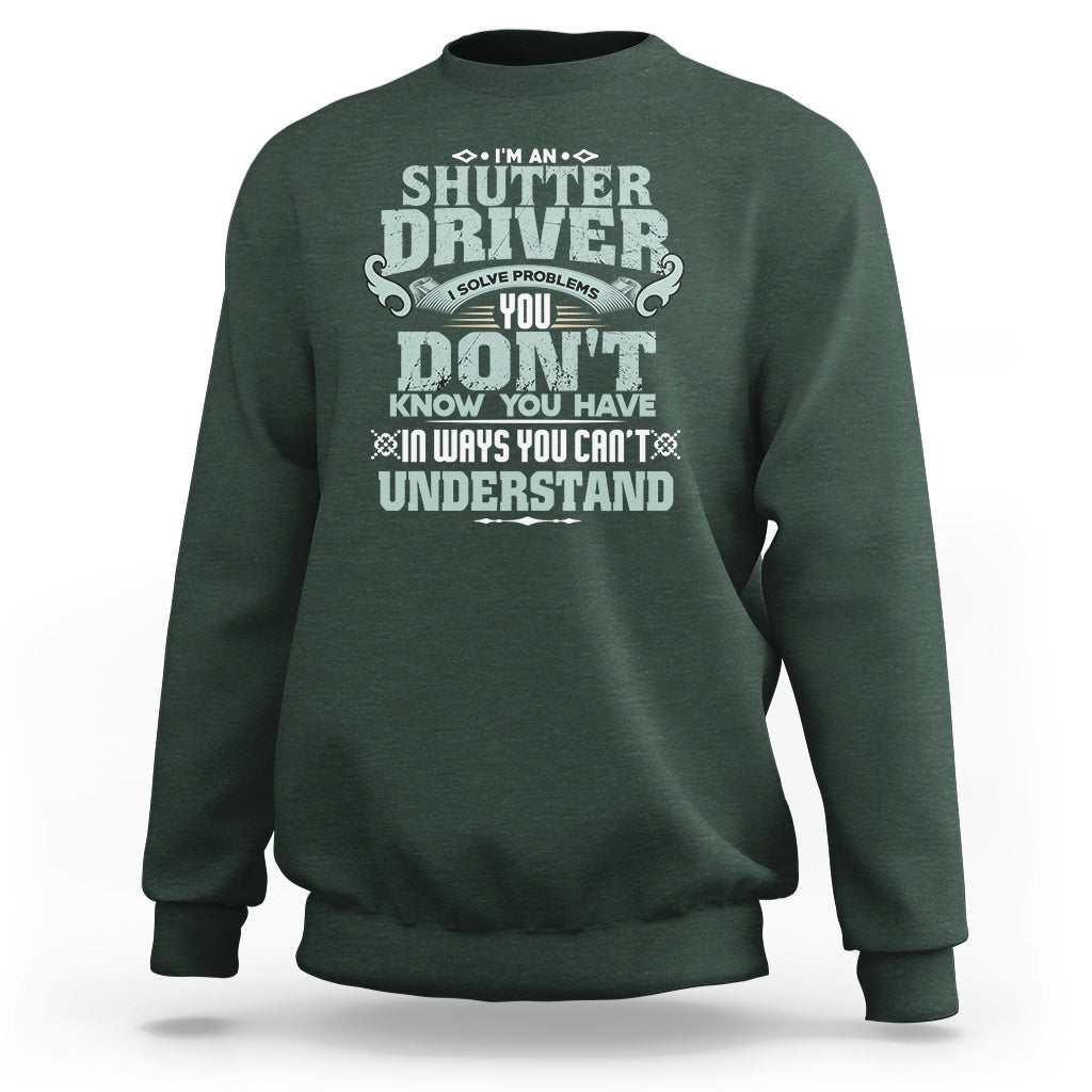Dark forest green crewneck sweatshirt with large front “Shutter Driver” graphic print.