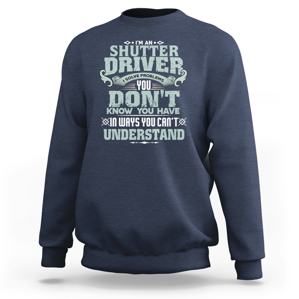 Navy crewneck sweatshirt with large front “Shutter Driver” graphic print.