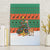 Giraffes Decorating Tree Gifts Canvas Wall Art with Orange Green Holiday Pattern Design - Wonder Print Shop