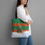 Giraffes Decorating Tree Gifts Tote Bag with Orange Green Holiday Pattern Design - Wonder Print Shop