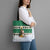 Llama Decorating Tree in Santa Hat Tote Bag with Green Gift Pattern Design - Wonder Print Shop