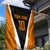 Bass Fishing Garden Flag Jumping Largemouth Fish on Black Hex Pattern and Orange White Lightning Accents - Wonder Print Shop