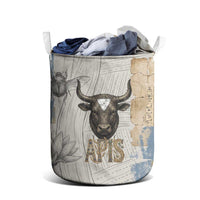 Apis Ancient Egyptian Laundry Basket with Beige-Gray Hieroglyphic, Ornate Bull Head, and Gold-Blue Typography - Wonder Print Shop