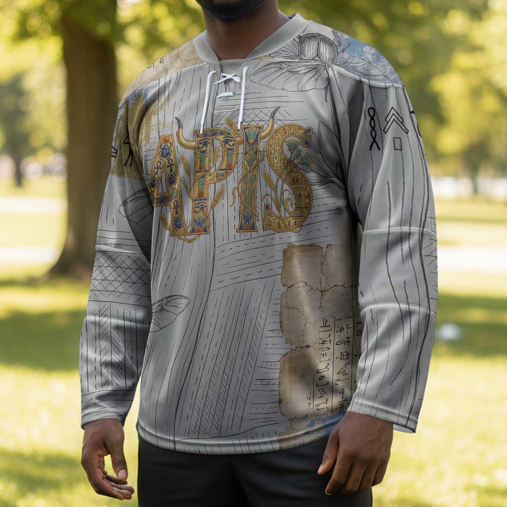 Apis Ancient Egyptian Hockey Jersey with Beige-Gray Hieroglyphic, Ornate Bull Head, and Gold-Blue Typography - Wonder Print Shop
