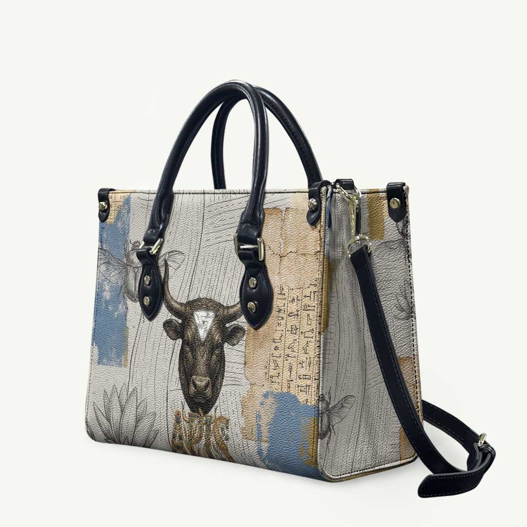 Apis Ancient Egyptian Leather Bag with Beige-Gray Hieroglyphic, Ornate Bull Head, and Gold-Blue Typography - Wonder Print Shop