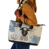 Apis Ancient Egyptian Leather Tote Bag with Beige-Gray Hieroglyphic, Ornate Bull Head, and Gold-Blue Typography - Wonder Print Shop