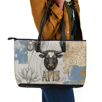 Apis Ancient Egyptian Leather Tote Bag with Beige-Gray Hieroglyphic, Ornate Bull Head, and Gold-Blue Typography - Wonder Print Shop