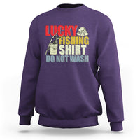 Purple fishing sweatshirt with Lucky Fishing Shirt 'Do Not Wash' graphic.