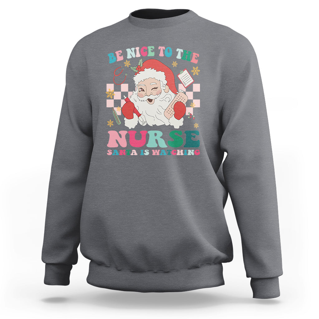 Be Nice To The Nurse Santa is Watching Christmas Sweatshirt - Wonder Print Shop