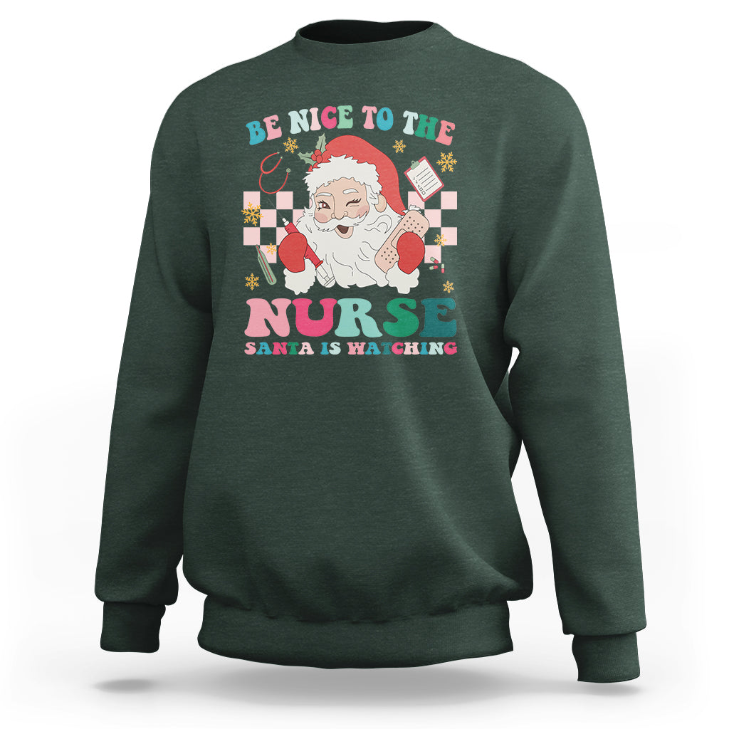 Be Nice To The Nurse Santa is Watching Christmas Sweatshirt - Wonder Print Shop