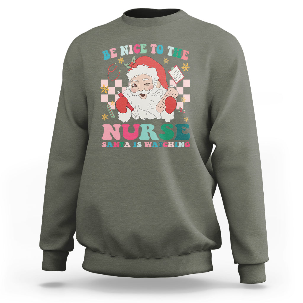 Be Nice To The Nurse Santa is Watching Christmas Sweatshirt - Wonder Print Shop