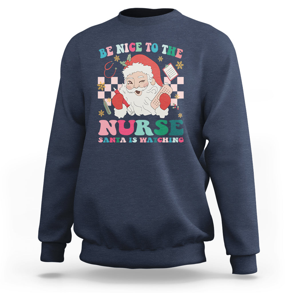 Be Nice To The Nurse Santa is Watching Christmas Sweatshirt - Wonder Print Shop