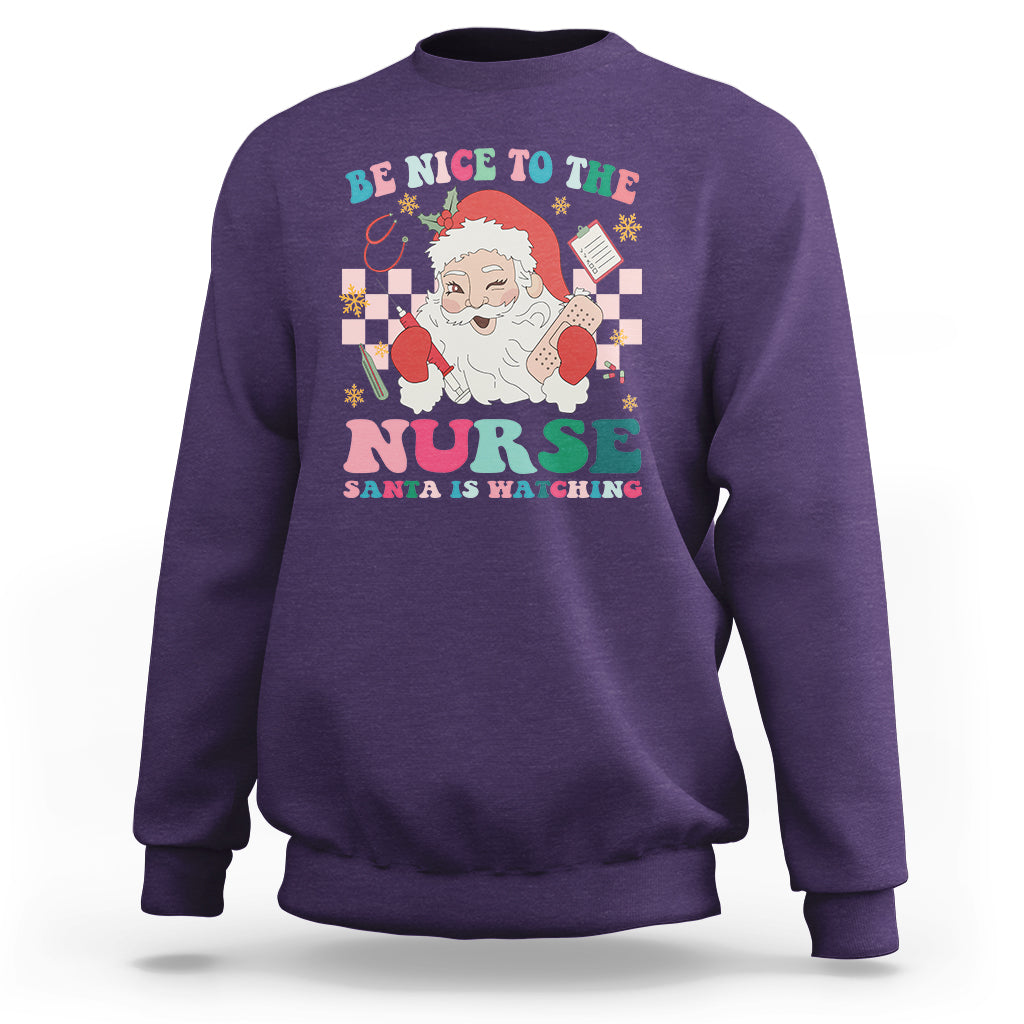 Be Nice To The Nurse Santa is Watching Christmas Sweatshirt - Wonder Print Shop