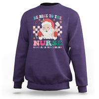 Be Nice To The Nurse Santa is Watching Christmas Sweatshirt - Wonder Print Shop