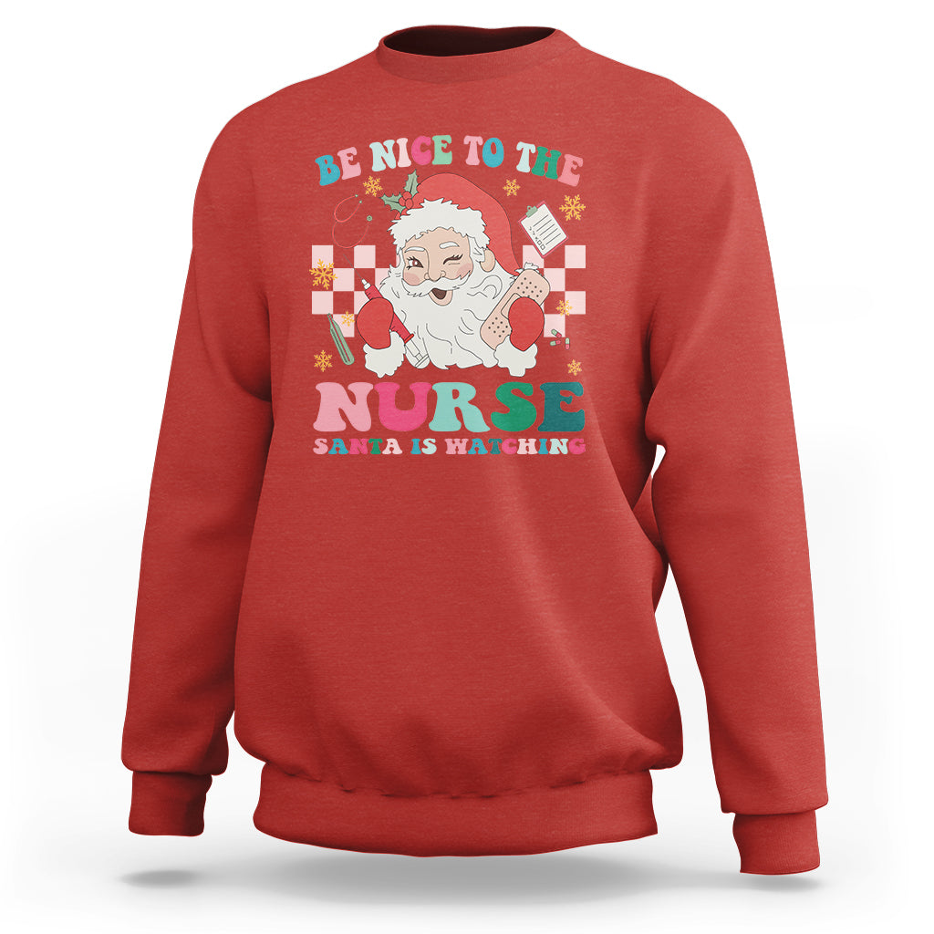 Be Nice To The Nurse Santa is Watching Christmas Sweatshirt - Wonder Print Shop