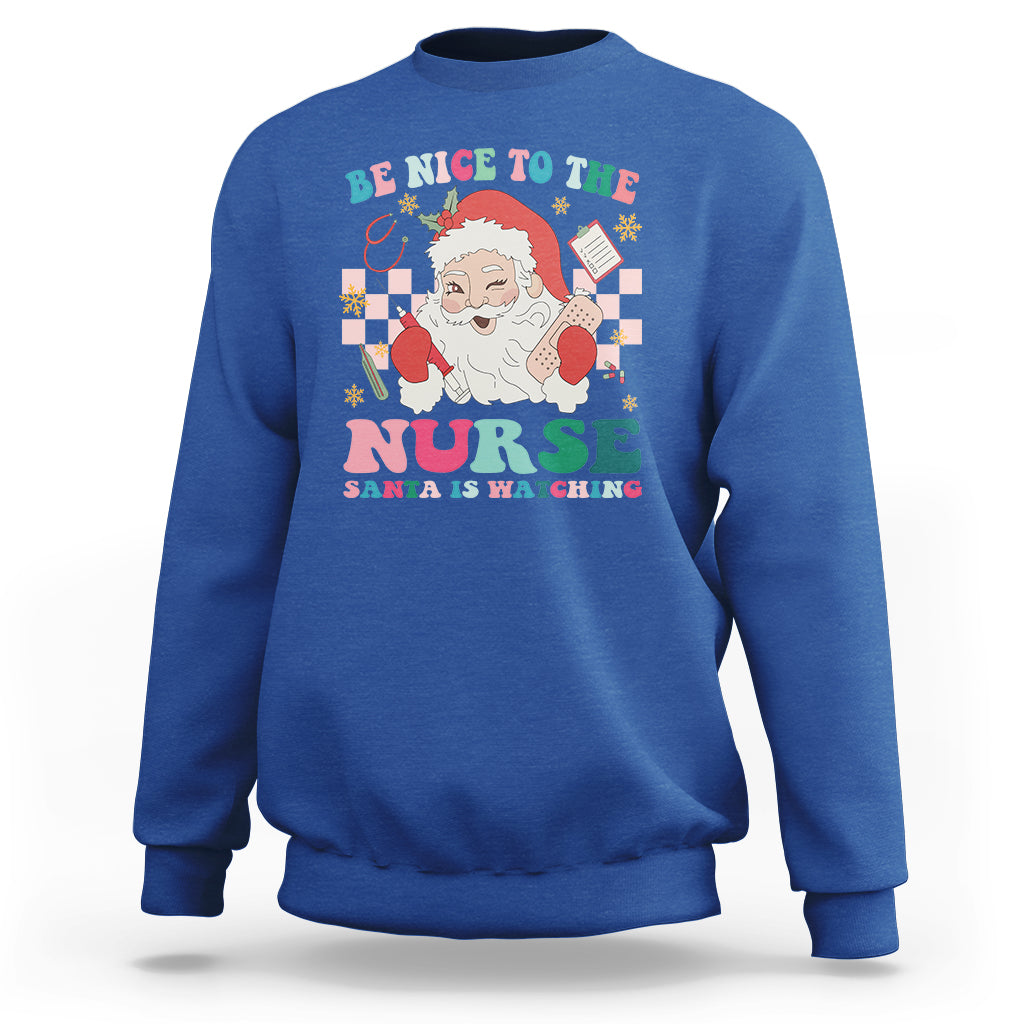 Be Nice To The Nurse Santa is Watching Christmas Sweatshirt - Wonder Print Shop
