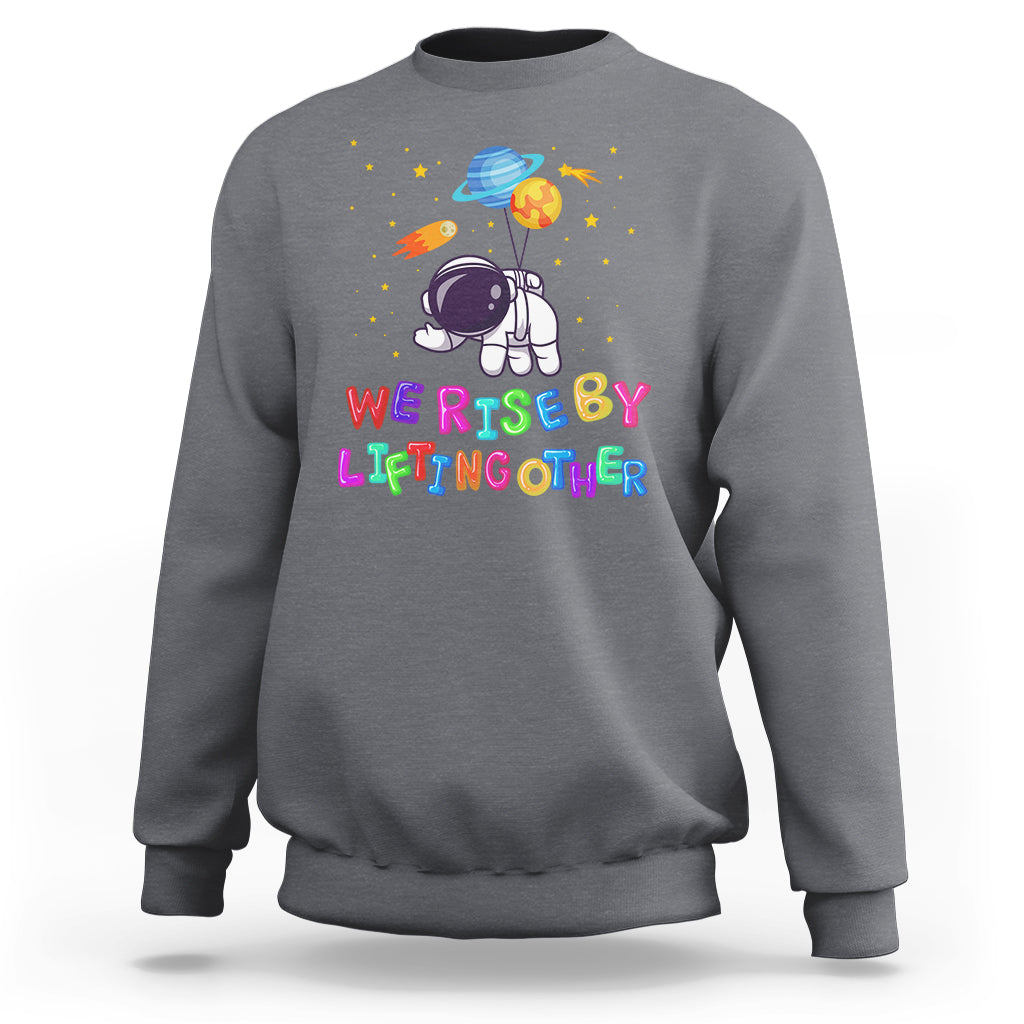 We Rise By Lifting Other Outer Space Astronaut Planet Balloon Motivational Quote Sweatshirt - Wonder Print Shop