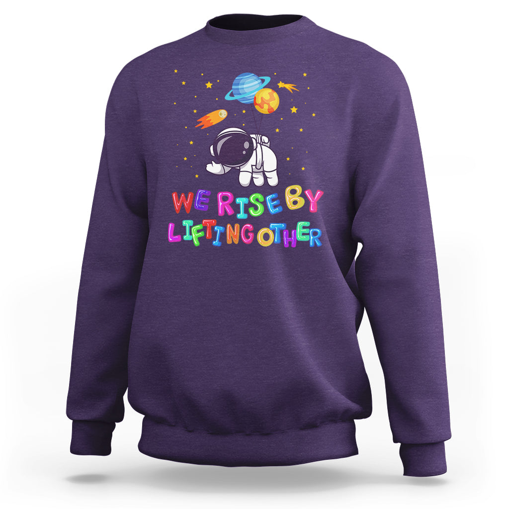 We Rise By Lifting Other Outer Space Astronaut Planet Balloon Motivational Quote Sweatshirt - Wonder Print Shop
