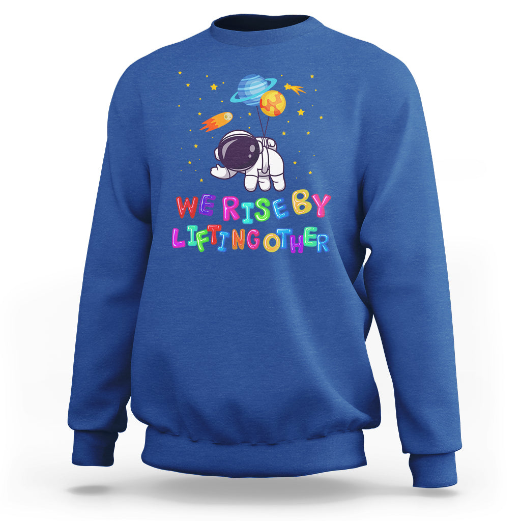 We Rise By Lifting Other Outer Space Astronaut Planet Balloon Motivational Quote Sweatshirt - Wonder Print Shop
