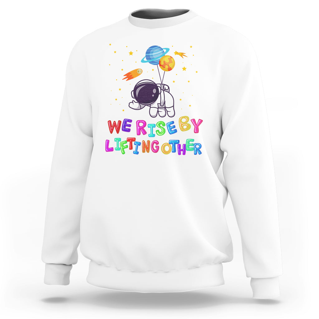 We Rise By Lifting Other Outer Space Astronaut Planet Balloon Motivational Quote Sweatshirt - Wonder Print Shop