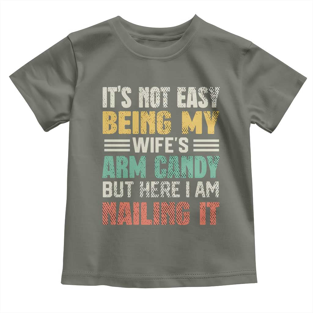 Funny Husband Toddler T Shirt It's Not Easy Being My Wife's Arm Candy
